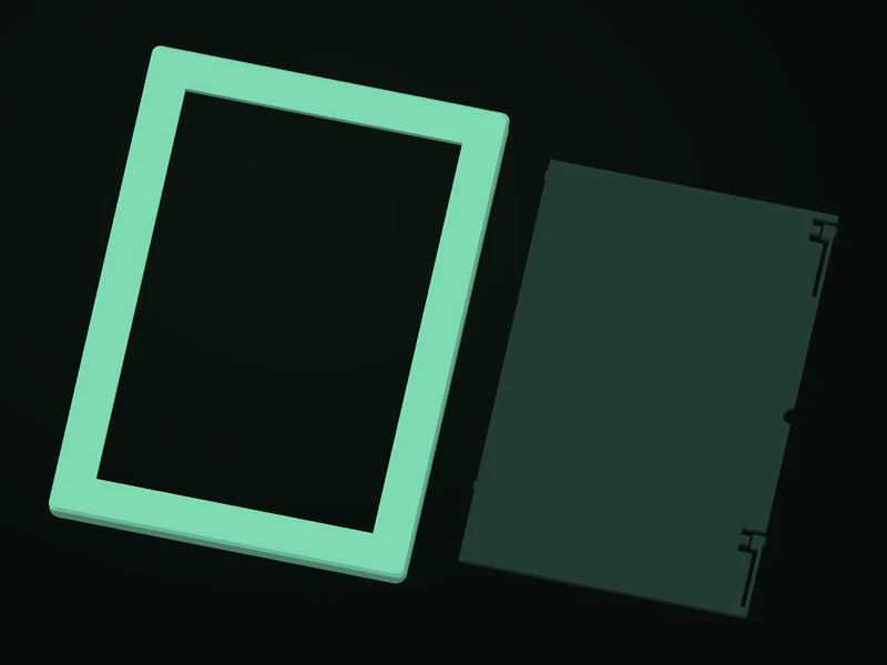 Actual mint photo frame and separate dark green back with releasable snap arms, without an inserted photo.